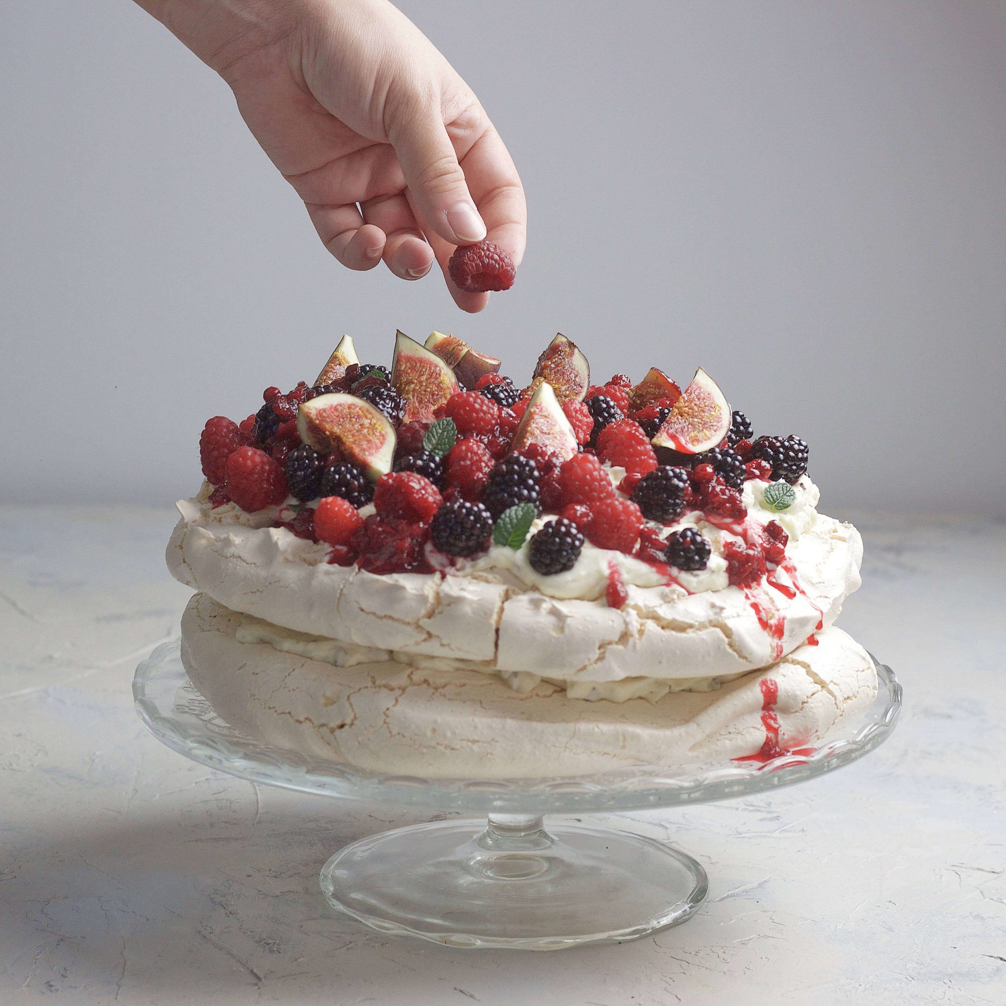 Pavlova meringue with fresh berries and stracciatella ​cream.
