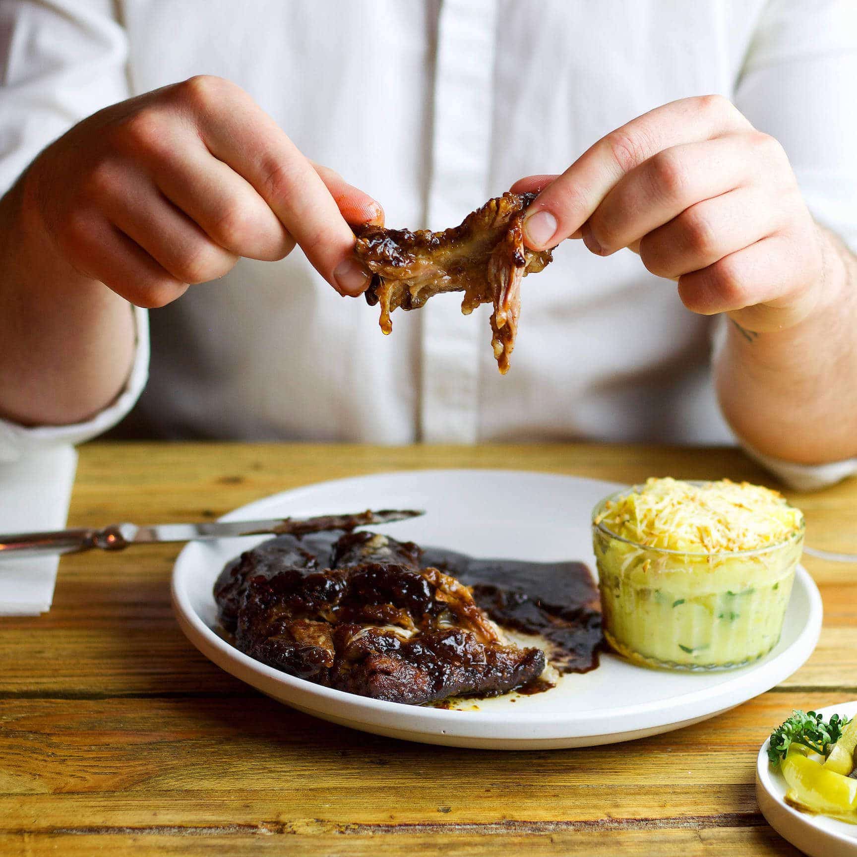 Slow roasted BBQ ribs with creamy sauce and baked mashed potatoes with smoked cheese. You will just lick your fingers. 1